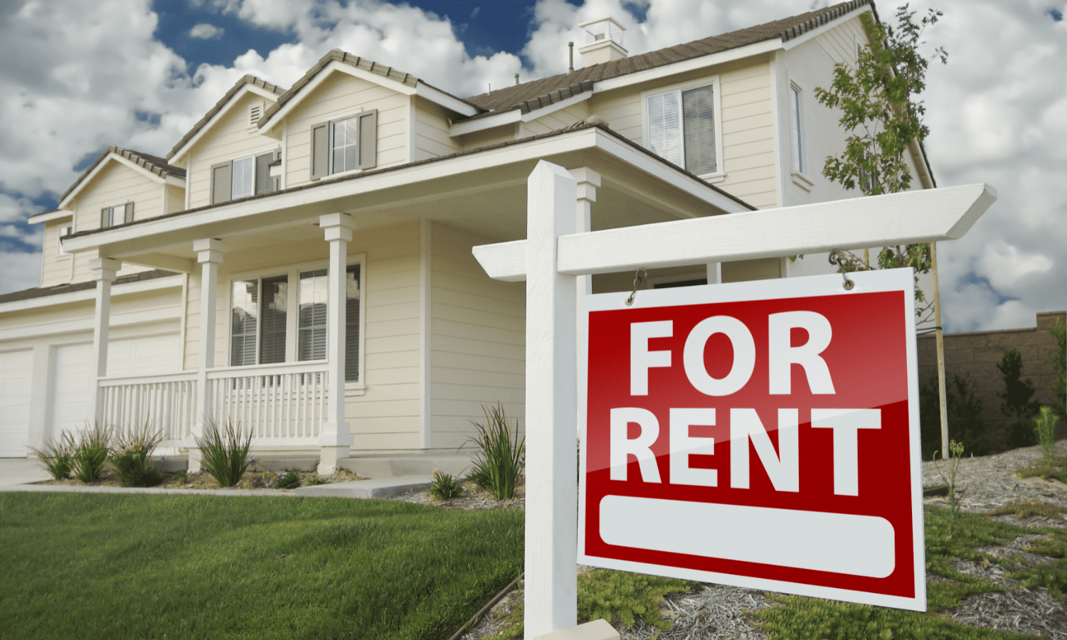 House with for rent sign in yard